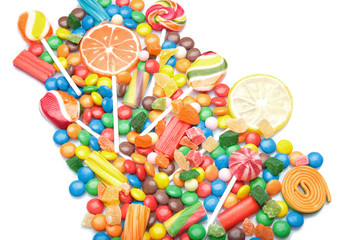 Fototapeta na wymiar Tasty lollipops and colorful candies on white background