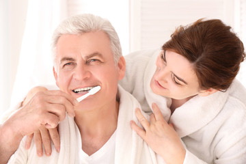 Morning of senior couple in bathroom