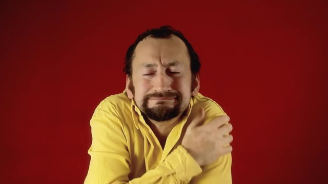 A funny ugly man feeling cold and shivering. Fast shot.

