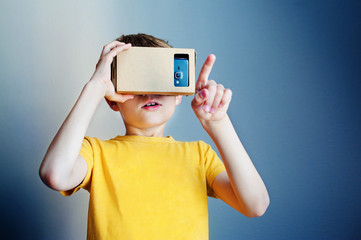 Boy wear with with VR device and finger touch in air