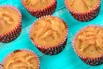Muffins on wooden table