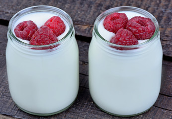 Raspberry with yogurt in a jars