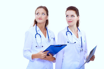 Fototapeta premium Two woman nurse watching X Ray image, standing in hospital