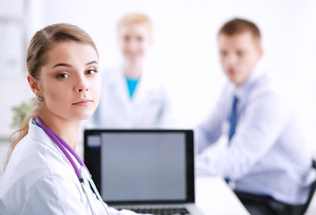 Obraz premium Women doctors sitting at the desk in hospital