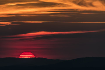 Fototapeta na wymiar Sunset over mountains in Decin town area