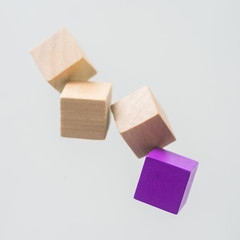 Business concept - Abstract geometric real floating wooden cube on grey background and it's not 3D render. the symbol of leadership, teamwork and growth.