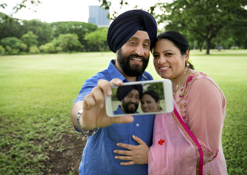 Indian Couple Taking Pictures Concept