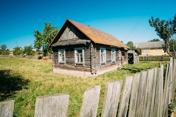 Fototapeta na wymiar Old Russian Traditional Wooden House In Village Of Belarus Or Russia