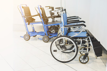 Empty wheelchair parked in hospital