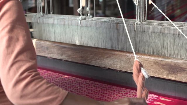 Nyaung Shwe, woman working with silk weaving