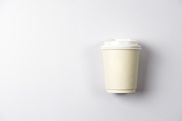 white paper coffee cup on white background. top view.