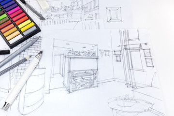 freehand sketch of living room interior and drawing tools on designers workplace