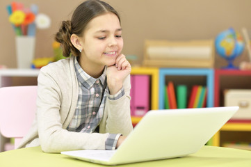 Teenage girl using a laptop