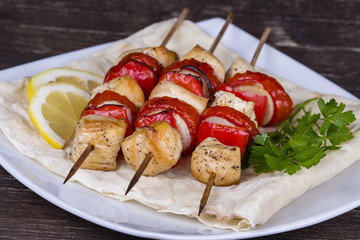 Tasty grilled meat and vegetables on skewer