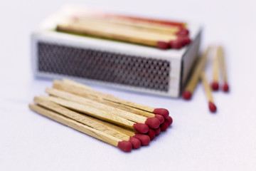 Box of matches on a wooden table, shot at close-up