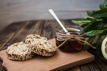 jar of honey with rice cookies