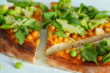 Vegan pizza with chickpeas and broccoli. Love for a healthy vegan food concept