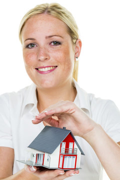 real estate agent with house and schlÃ¼Ãel