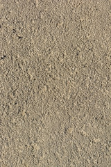 Abstract background of closeup dark uneven asphalt