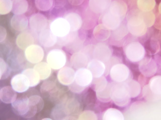 Festive blurry purple background, bokeh lights.