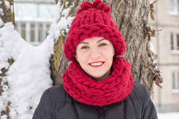 Cute girl in a warm hat in winter