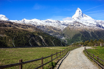 Trail with view of Matterhorn Peak in summer at Sunnega station, Rothorn Paradise, Zermatt, Switzerland.