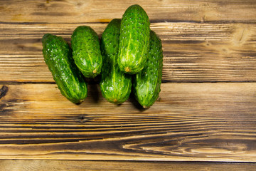 Fresh cucumbers on wooden table