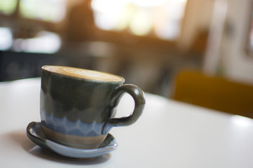 Close up of hot cappuccino on the table at the cafe