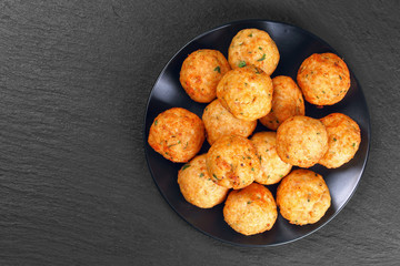 delicious roasted meatballs on black plate