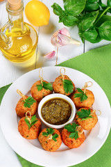 meatballs on skewers with sauce pesto