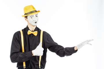 Portrait of a man, artist,clown,MIME.Shows up on something. Isolated on white background