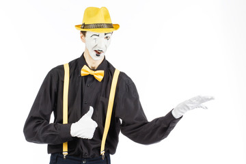 Portrait of a man, artist,clown,MIME.Shows up on something. Isolated on white background