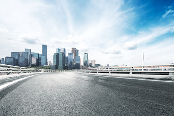 empty road with modern city