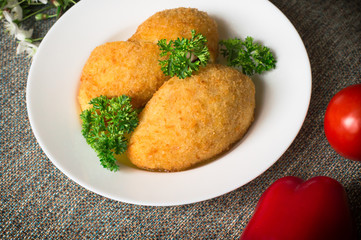 Chicken cutlets on Kiev. Old background. Top view. Close-up