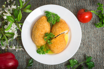 Chicken cutlets on Kiev. Old background. Top view. Close-up