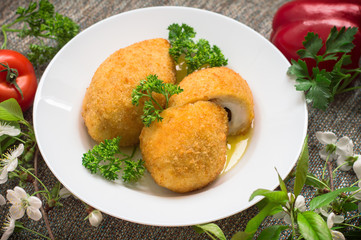 Chicken cutlets on Kiev. Old background. Top view. Close-up
