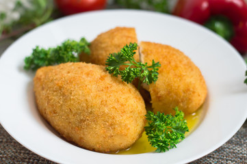 Chicken cutlets on Kiev. Old background. Top view. Close-up