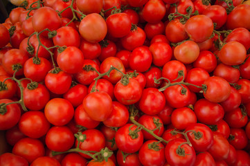 Fresh tomatoes organic at outdoor market. Top view. Close-up