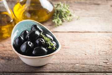 Bowl filled with fresh black olives