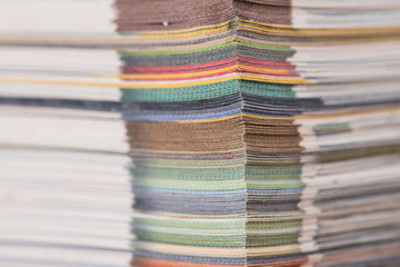 stack of colorful magazines or documents - paper