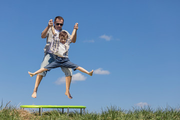 Father and son playing on the field at the day time.