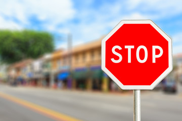 Obraz premium Stop sign by the City road