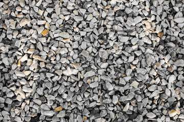 stone wall texture photo and white stones in the park,   stone background, stone floor texture.
