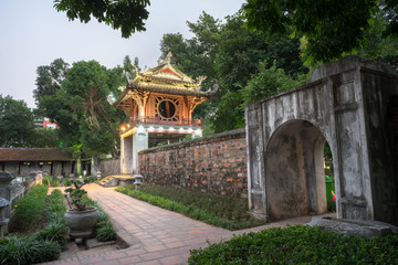 Fototapeta na wymiar Khue Van Cac ( Stelae of Doctors ) in Temple of Literature ( Van Mieu ) at night. The temple hosts the 