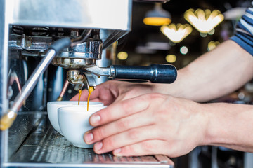 side view of barista preparing fresh coffee in cafe