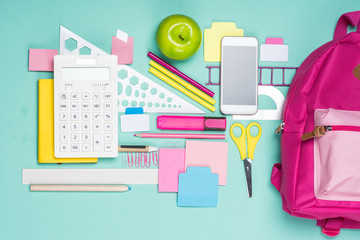 flat lay with various school supplies on colorful surface