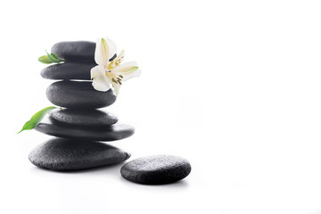 Fototapeta na wymiar Zen stones with flower isolated on white, spa treatment concept