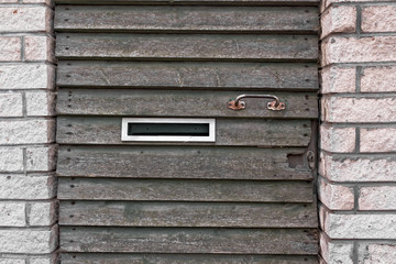 Mailbox And Handle On An Old Door