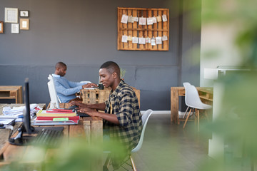 Fototapeta premium Focused African businessmen hard at work in a modern office