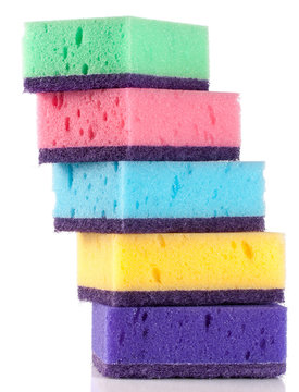 multicolored sponges for dishwashing isolated on a white background